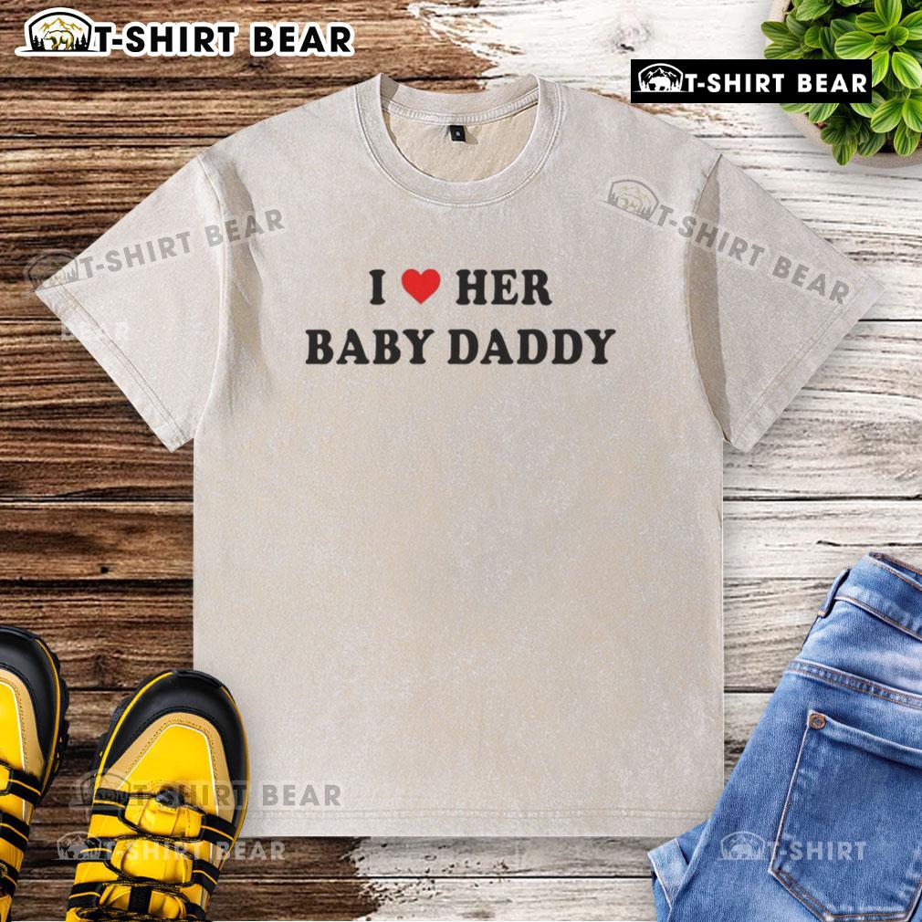 Good I Love Her Baby Daddy washed t-shirt displayed on a hanger, perfect for casual wear and expressing love.