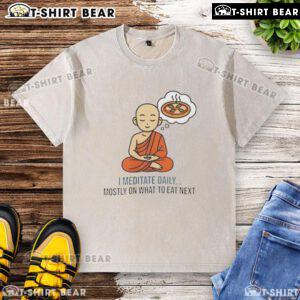 Person meditating daily in a washed t-shirt, focusing on healthy eating choices and mindfulness practices.