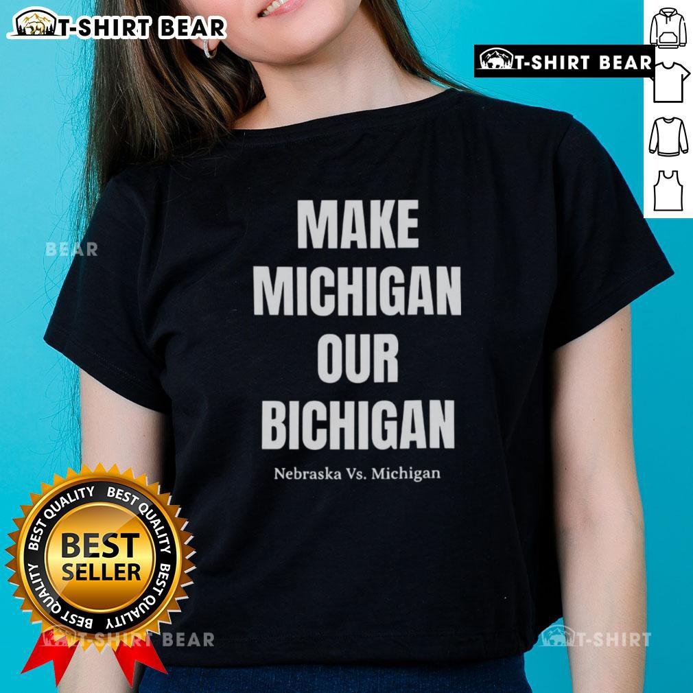 Alt Text: Nebraska vs Michigan ladies tee featuring 'Good Make Michigan Our Bichigan' design, perfect for game day style.