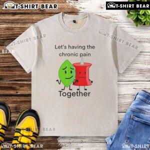Happy group wearing 'Let's Have Chronic Pain Together' washed t-shirts, promoting awareness and support for chronic pain.