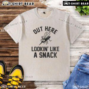 Happy mosquito graphic on a 'Lookin' Like a Snack' washed t-shirt, perfect for summer casual wear.