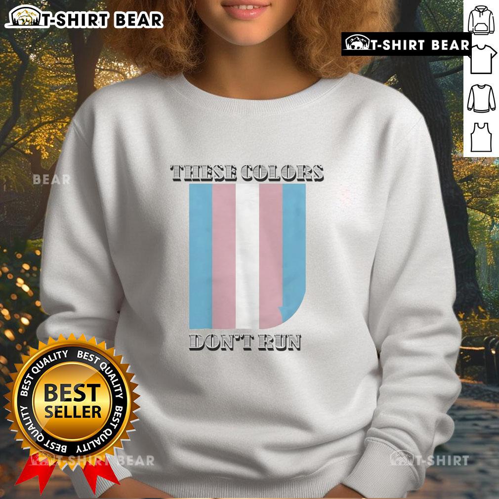 Happy 'These Colors Don't Run' Trans Sweatshirt in vibrant colors, promoting pride and inclusivity in fashion.