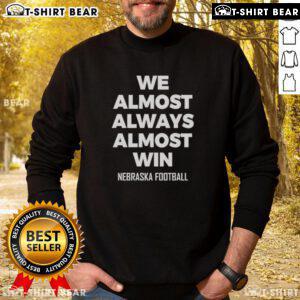 Hot We Almost Always Almost Win Nebraska Football Sweatshirt in red, showcasing team spirit and stylish design.