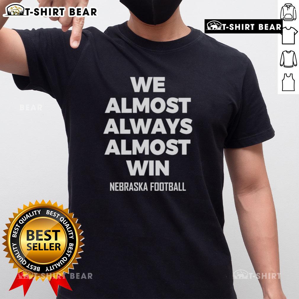 Alt Text: Hot We Almost Always Almost Win Nebraska Football T-Shirt featuring bold graphics and vibrant colors for fans.