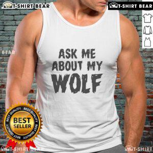 Person wearing a 'Nice Ask Me About My Wolf' tank top, showcasing a stylish wolf graphic at a vibrant outdoor setting.