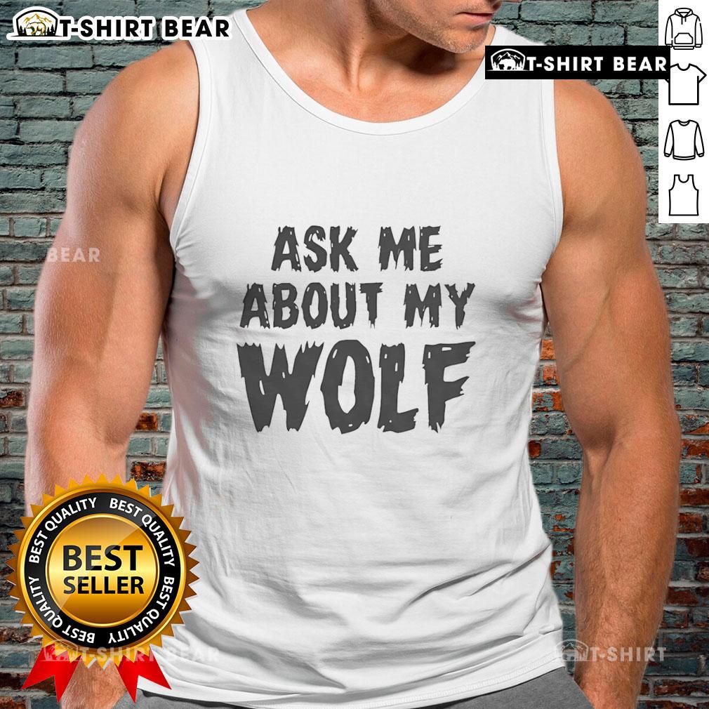 Person wearing a 'Nice Ask Me About My Wolf' tank top, showcasing a stylish wolf graphic at a vibrant outdoor setting.