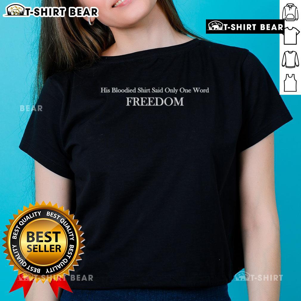 Alt Text: Charlie Kirk wearing a bloodied shirt with the word 'Freedom' on a stylish ladies tee, promoting liberty and resilience.