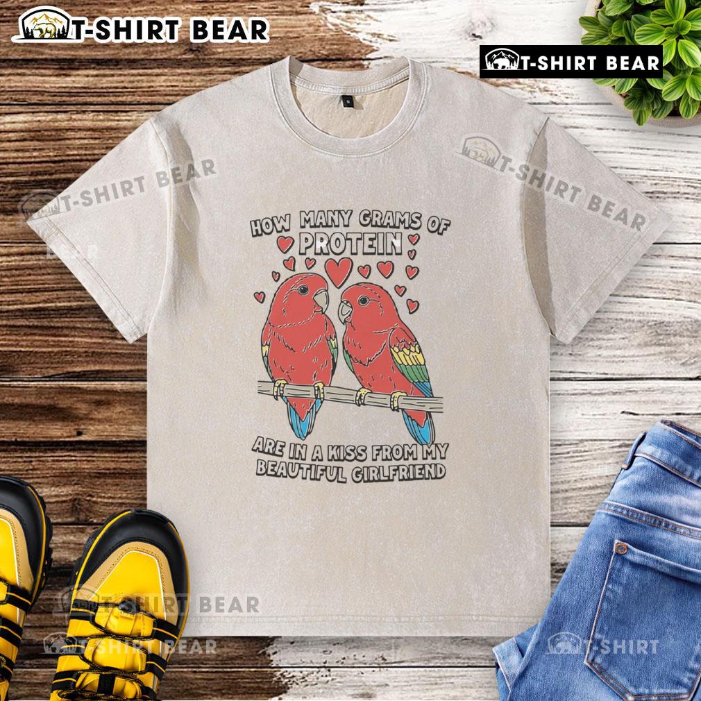 Alt Text: Washed t-shirt with the phrase 'How Many Grams Of Protein Are In A Kiss From My Beautiful Girlfriend' printed on it.