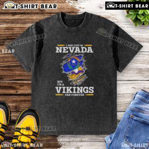 Official I May Live In Nevada But I'm A Minnesota Vikings Fan Forever washed t-shirt showcasing team pride.