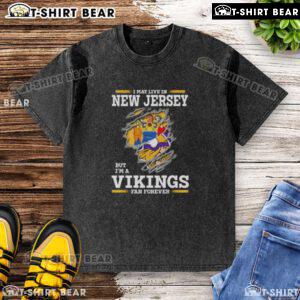 Official I May Live In New Jersey But I'm A Minnesota Vikings Fan Forever washed t-shirt design featuring team colors.