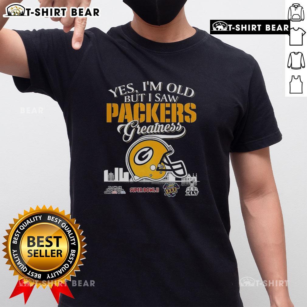 Alt Text: Official Yes Im Old But I Saw Green Bay Packers Greatness T-Shirt featuring Super Bowl helmet and city skyline design.