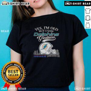 Alt Text: Ladies tee featuring Miami Dolphins Super Bowl helmet and skyline, perfect for fans celebrating team greatness.