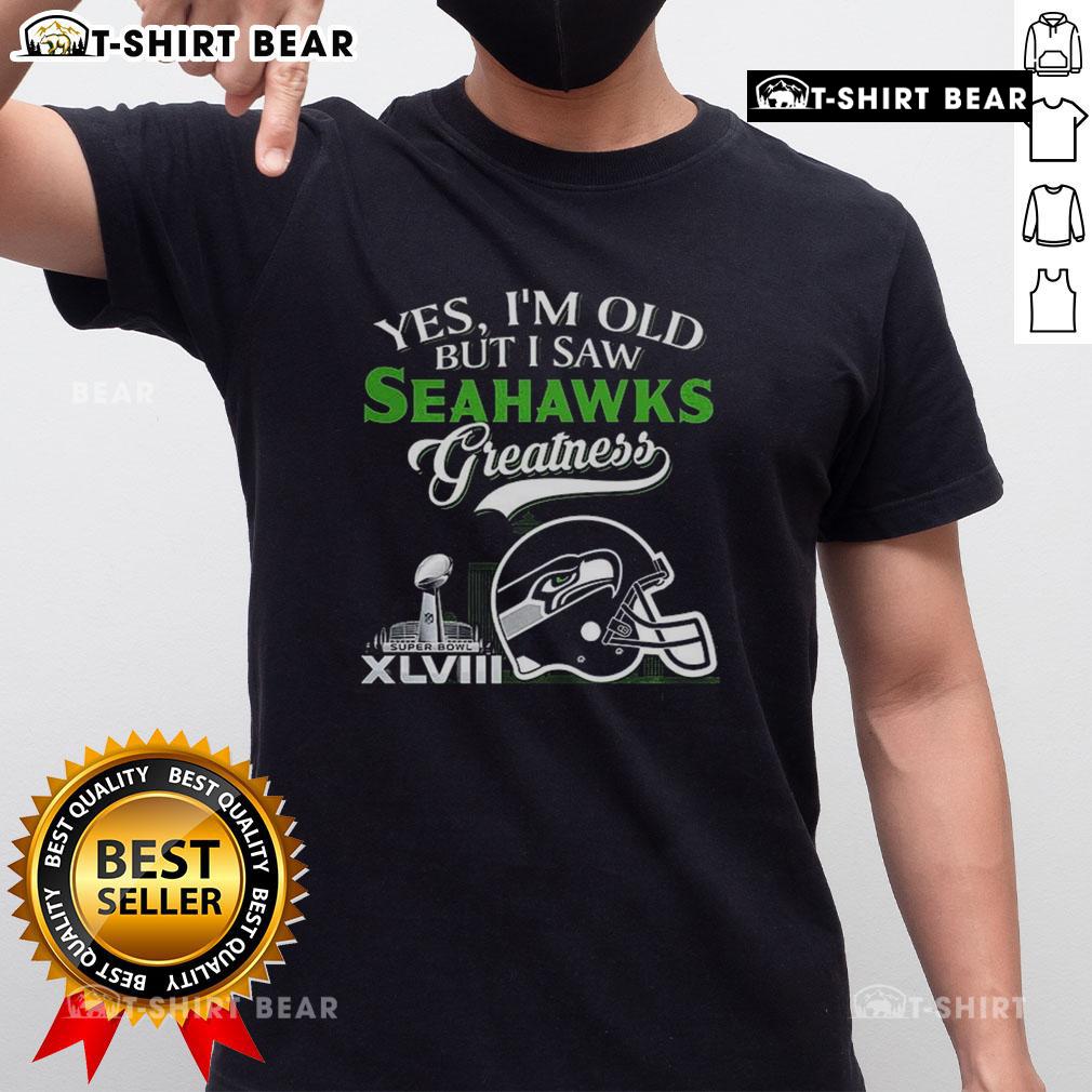 Alt Text: Yes Im Old But I Seattle Seahawks Greatness T-Shirt with Super Bowl helmet and city skyline design.