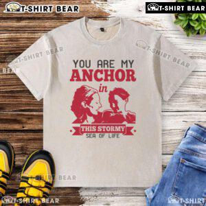 Official You Are My Anchor In This Stormy Sea Of Life washed T-shirt displayed on a wooden background.