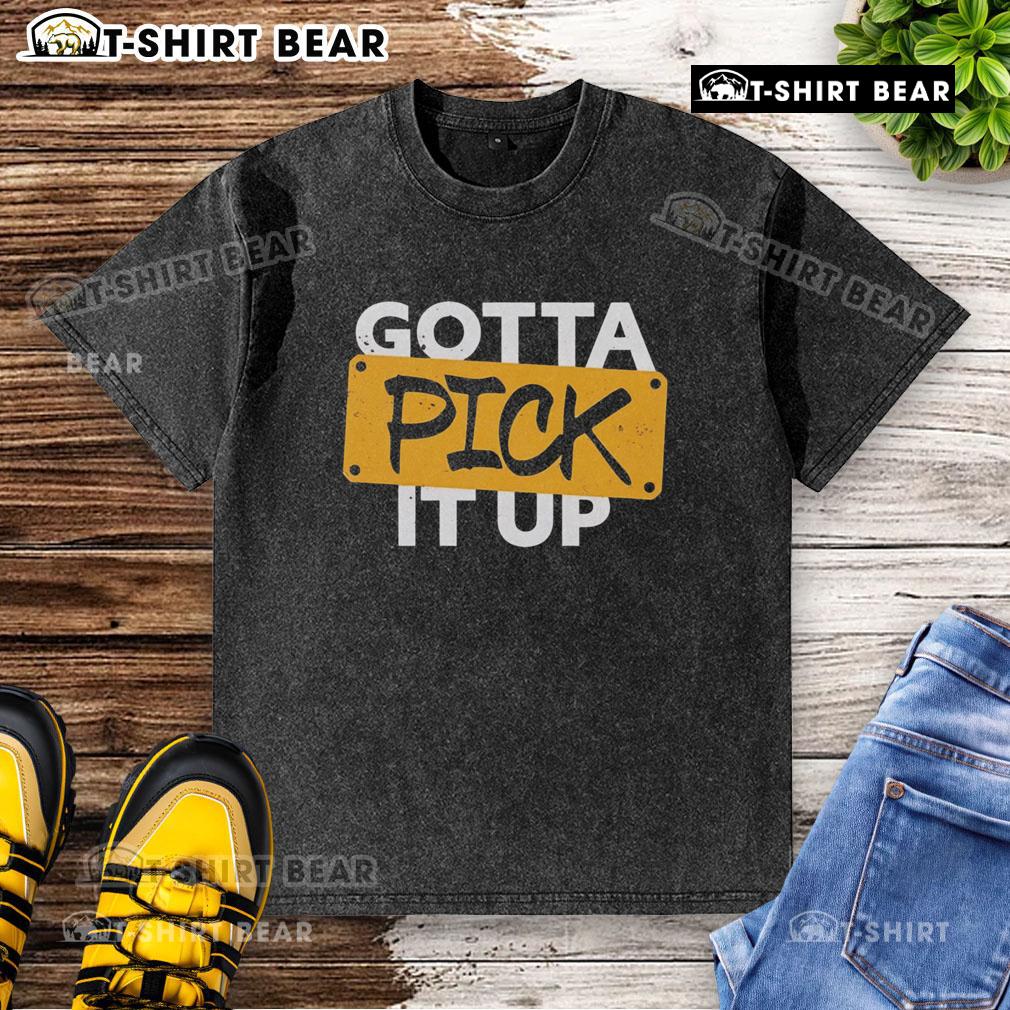Original Gotta Pick It Up The Challenge washed t-shirt in a casual setting, showcasing its unique design and style.