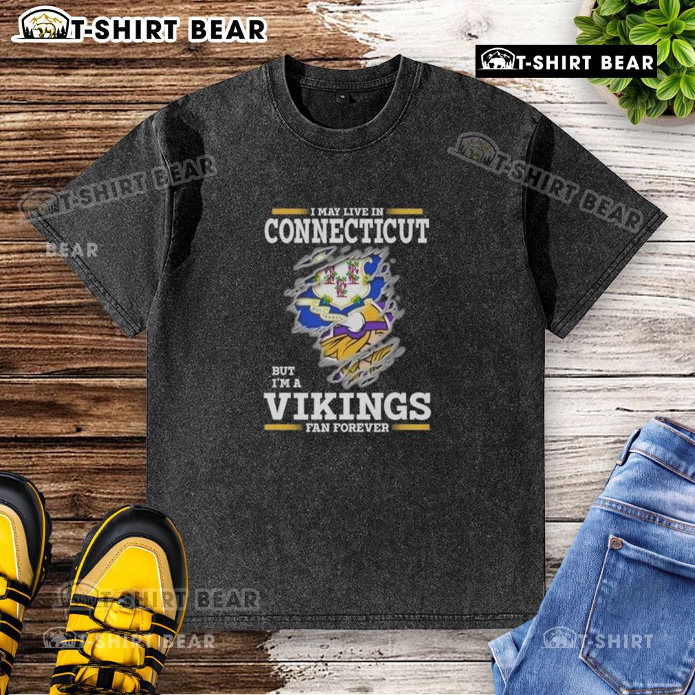 Original I May Live In Connecticut But I'm A Minnesota Vikings Fan Forever washed t-shirt displayed on a hanger.