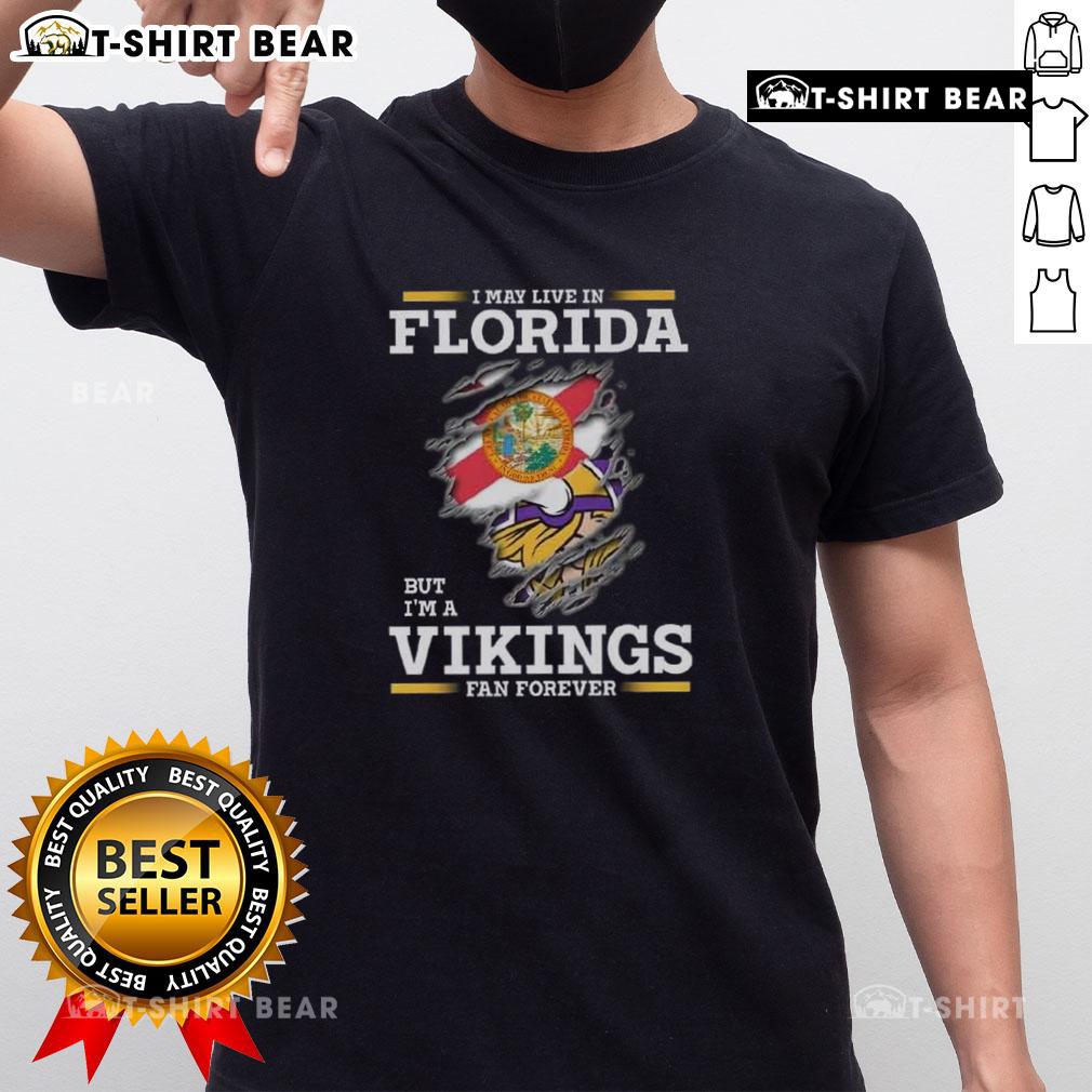 Original 'I May Live In Florida But I'm A Minnesota Vikings Fan Forever' T-Shirt showcasing team pride and sunny vibes.
