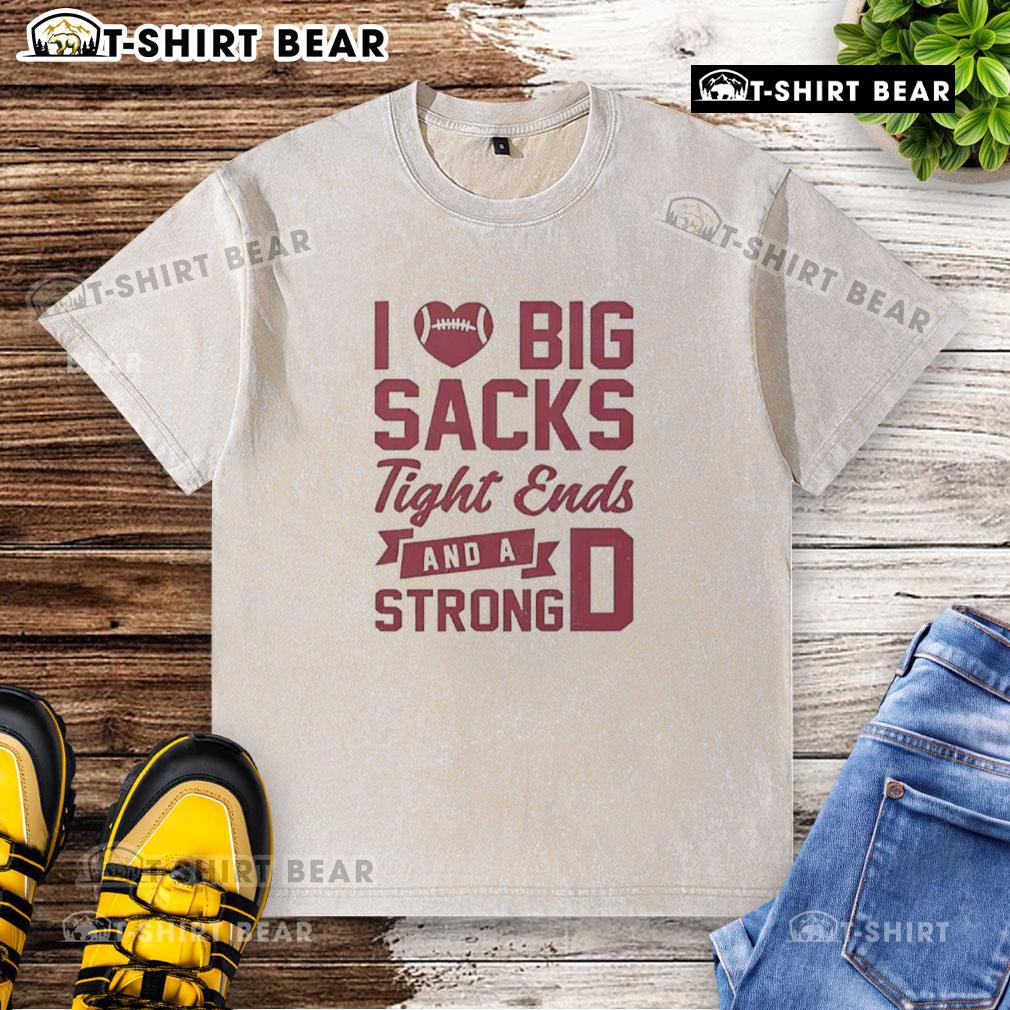 Alt Text: Casual washed t-shirt featuring 'I Love Big Sacks, Tight Ends, and a Strong D' graphic design for sports fans.