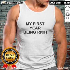 Alt Text: Jalen Carter in a stylish tank top celebrating his first year with the Eagles, showcasing wealth and success.