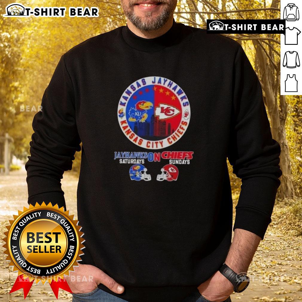 Cozy sweatshirt featuring Jayhawks and Chiefs logos, perfect for Kansas sports fans on game days.