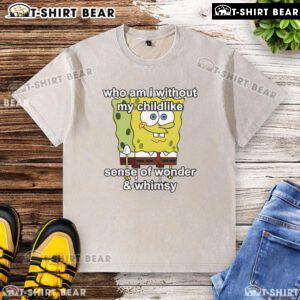 Top Sponge 'Who Am I Without My Childlike Sense Of Wonder' washed t-shirt displayed on a wooden background.