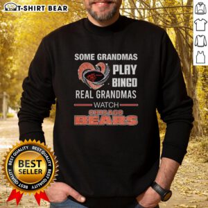 Grandmas enjoying bingo while wearing a Chicago Bears sweatshirt with a diamond heart design, celebrating game day.
