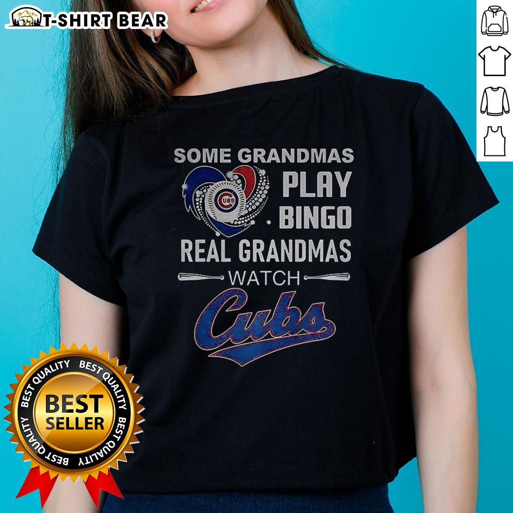 Grandmas enjoying bingo while wearing Chicago Cubs baseball tees, showcasing love for the game and fun activities.