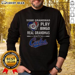 Grandmas playing bingo while wearing Chicago Cubs baseball sweatshirts, showcasing fun moments and team spirit.