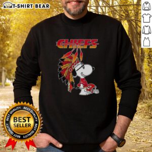 Alt Text: Cute Snoopy in war bonnets on a Kansas City Chiefs football helmet sweatshirt design, perfect for NFL fans.