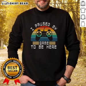 Alt Text: Retro vintage gamer sweatshirt featuring I Paused My Game To Be Here design against a sunset background.