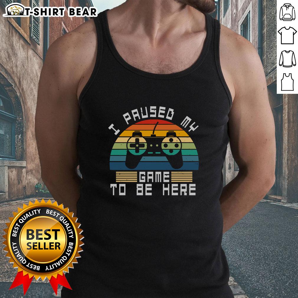 Alt Text: Funny I Paused My Game To Be Here retro vintage gamer tank top against a sunset backdrop, perfect for gaming enthusiasts.