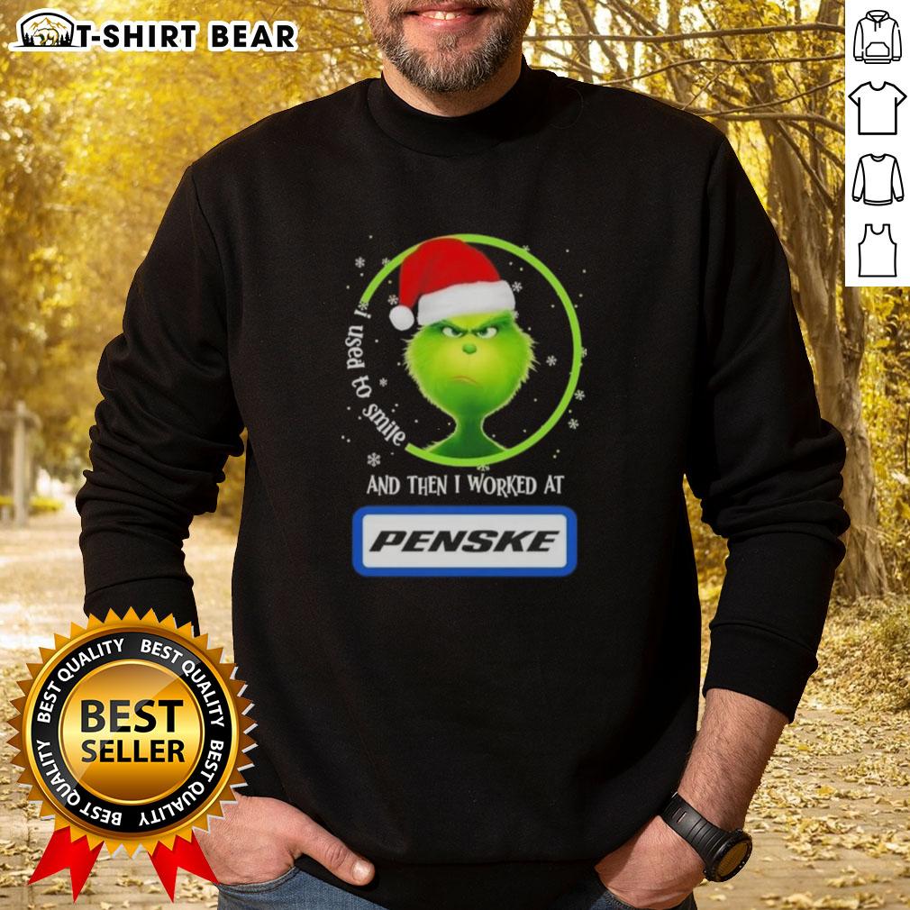 Alt Text: Good Grinch Christmas sweatshirt featuring 'I Used to Smile, Then I Worked at Penske Corporation' design.