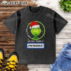 Good Grinch Christmas T-shirt featuring a whimsical design with text about smiling and working at Penske Corporation.