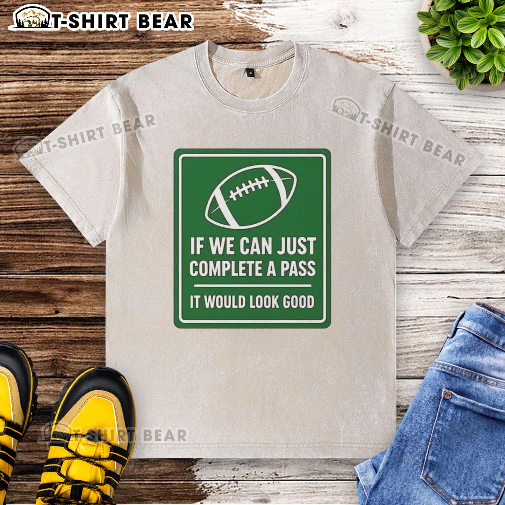 Football-themed washed t-shirt with 'Hot If We Can Complete A Pass' signboard design, perfect for sports enthusiasts.