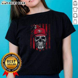 Hot San Francisco 49ers NFL skull graphic on American flag design for football lover ladies' tee.