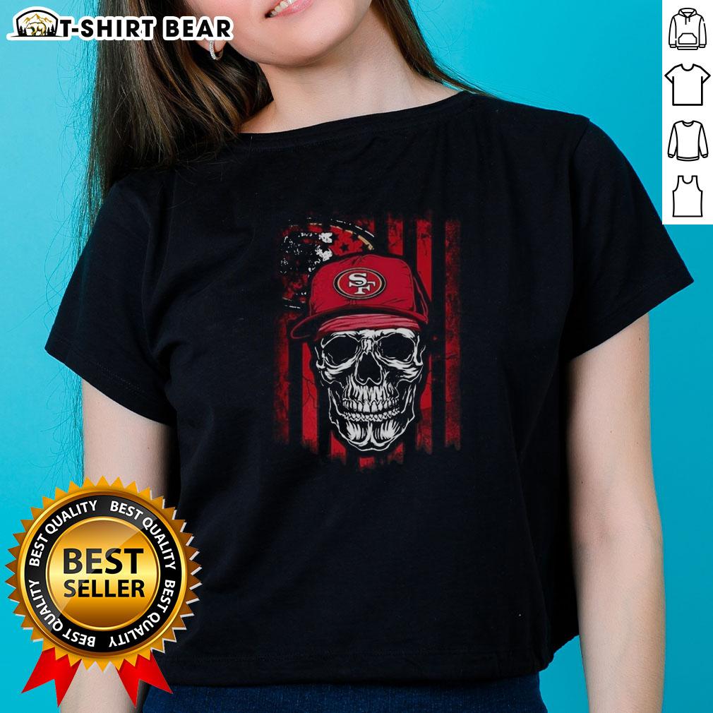Hot San Francisco 49ers NFL skull graphic on American flag design for football lover ladies' tee.