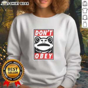 Colorful Nice Portland Frog sweatshirt featuring bold text: 'Demand That You Dont Obey' for unique fashion statement.