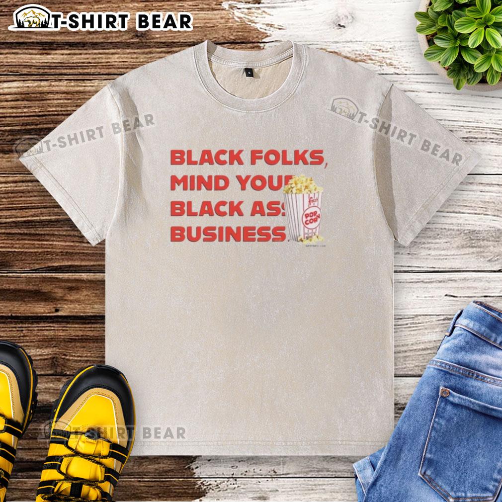 Alt Text: Official Popcorn Black Folks 'Mind Your Black Ass Business' washed t-shirt showcasing bold graphic design.