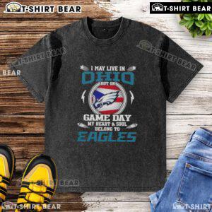 Alt Text: Washed t-shirt with 'I May Live In Ohio But My Heart Belongs To Philadelphia Eagles' slogan, perfect for game day.
