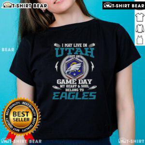 Ladies tee: 'I May Live In Utah, But On Game Day My Heart Belongs To Philadelphia Eagles,' perfect for fans.