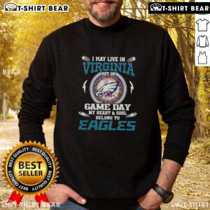 Cozy sweatshirt featuring 'I may live in Virginia, but on game day, my heart belongs to Philadelphia Eagles' design.