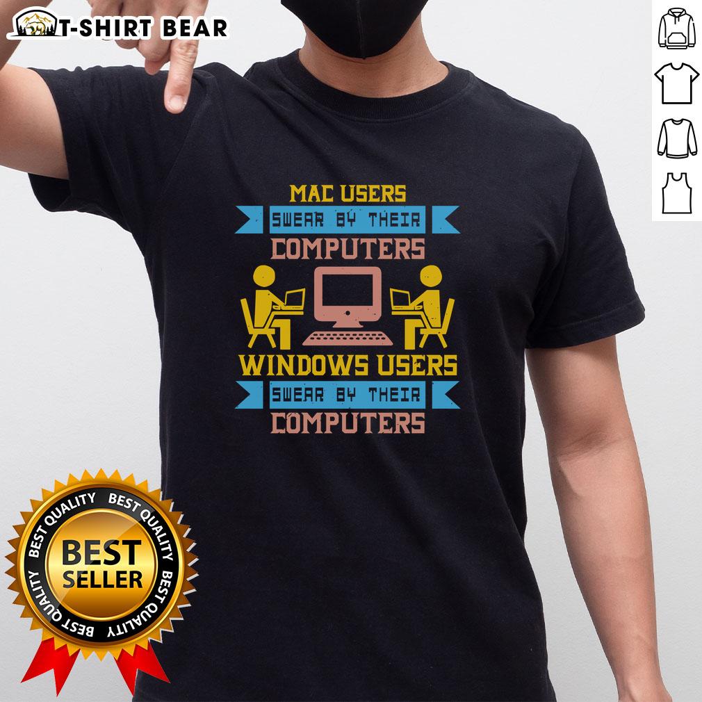 Premium Mac Users Swear By Their Computers vs Windows Users T-Shirt design showcasing playful tech rivalry.