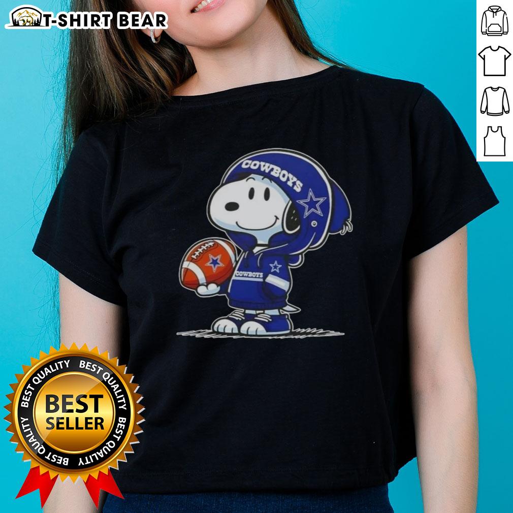 Snoopy in a Dallas Cowboys hoodie smiles at fans on a ladies tee, showcasing awesome peanuts character design.