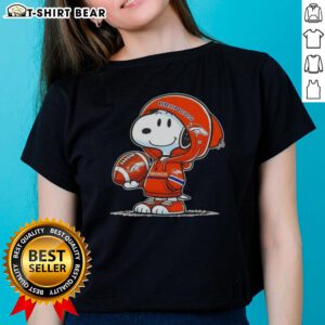 Snoopy in a Denver Broncos hoodie smiling at fans, featured on an awesome ladies tee.