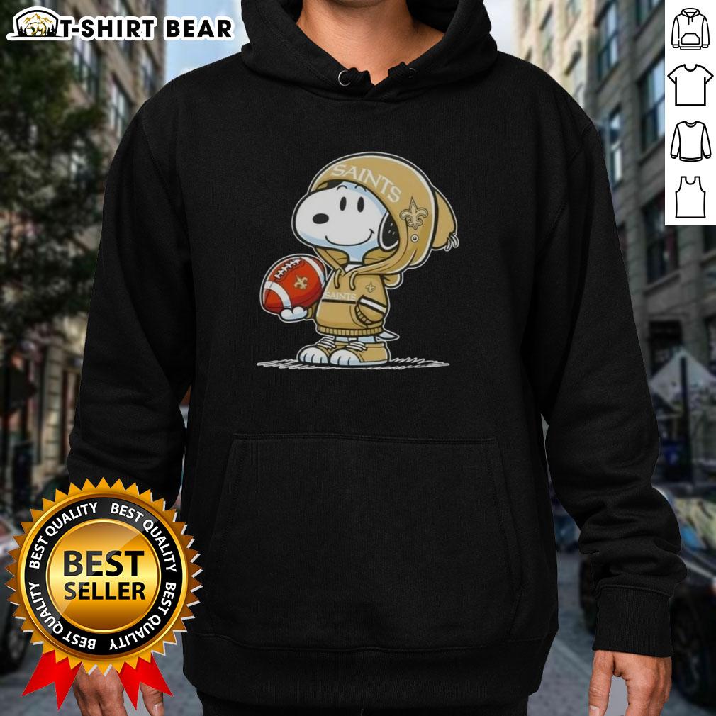 Snoopy wearing a New Orleans Saints hoodie, smiling at fans, showcasing his official Peanuts merchandise.