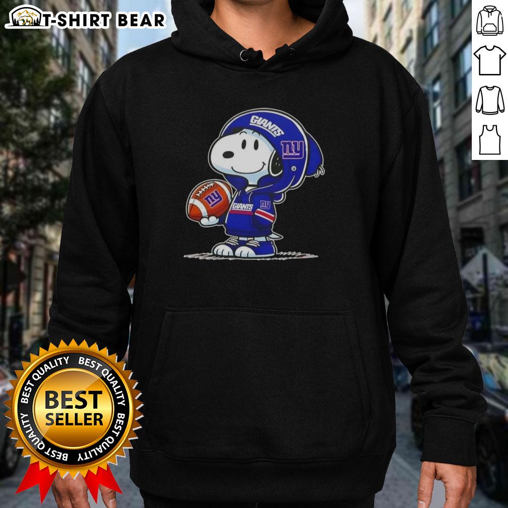 Alt Text: Snoopy in a New York Giants hoodie, smiling at fans, showcasing official Peanuts merchandise and team spirit.