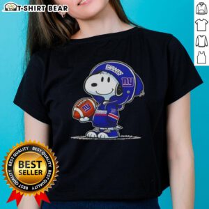 Official Peanuts Snoopy in New York Giants hoodie smiling at fans on a ladies tee, perfect for sports lovers.
