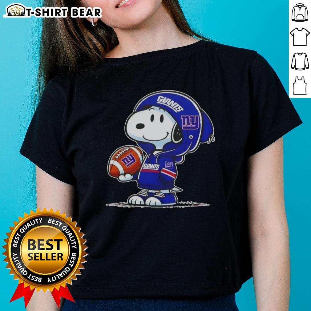Official Peanuts Snoopy in New York Giants hoodie smiling at fans on a ladies tee, perfect for sports lovers.