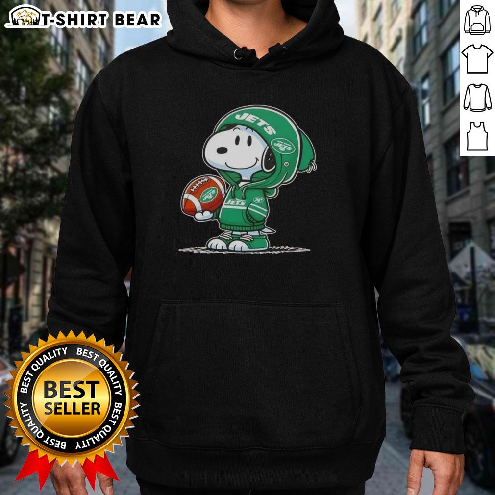 Alt Text: Snoopy in a New York Jets hoodie, smiling at fans, showcasing official Peanuts merchandise with team spirit.