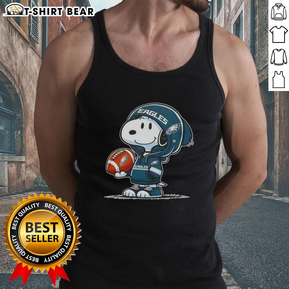 Alt Text: Snoopy in a Philadelphia Eagles hoodie, smiling at fans, featured on an official Peanuts tank top design.